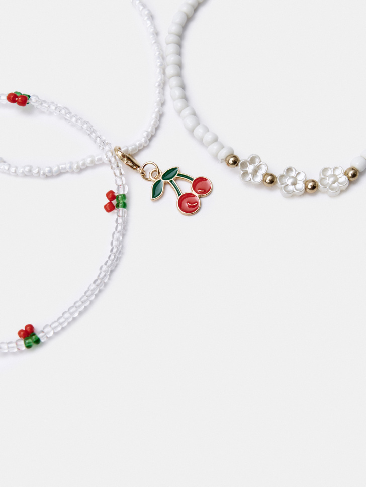 набор браслетов на ногу из бисера для девочек от бренда sela вид слева