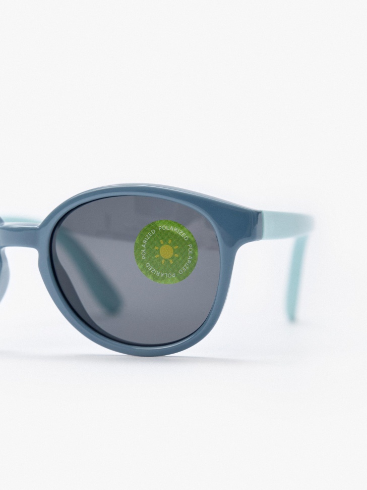 солнцезащитные очки для мальчиков от бренда sela вид слева