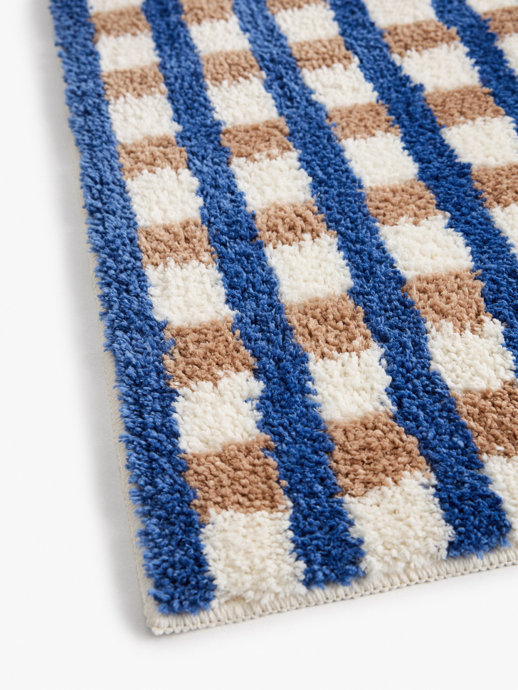 коврик для ванной в клетку от бренда sela вид слева