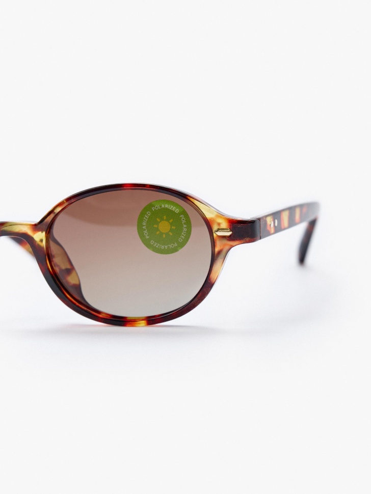 овальные солнцезащитные очки в роговой оправе для девочек от бренда sela вид слева