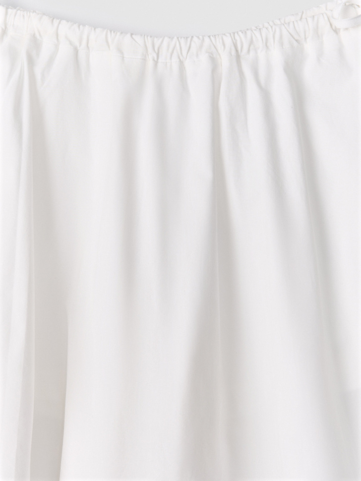 мини юбка-шорты с завязками от бренда sela вид слева