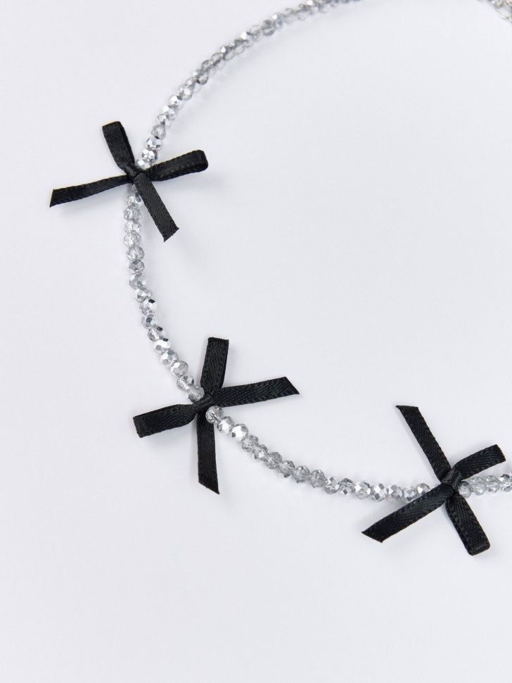 цепочка серебристая с бантиками для девочек от бренда sela вид слева