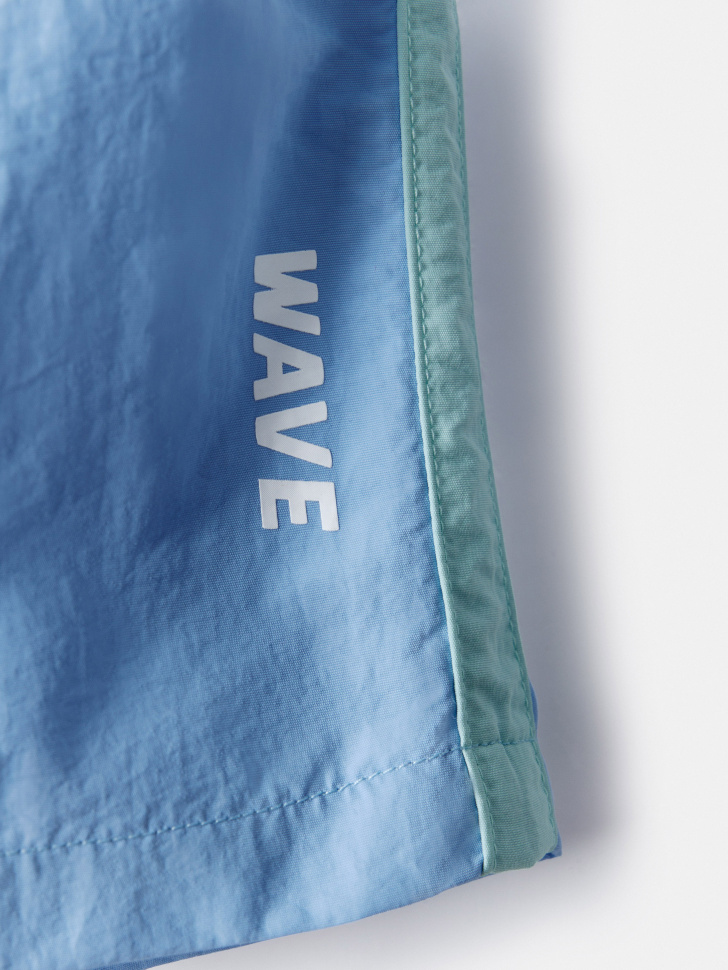 пляжные шорты с лампасами для мальчиков от бренда sela вид слева