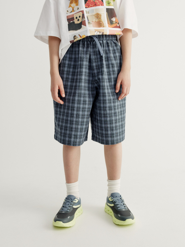 шорты в клетку для мальчиков от бренда sela вид слева