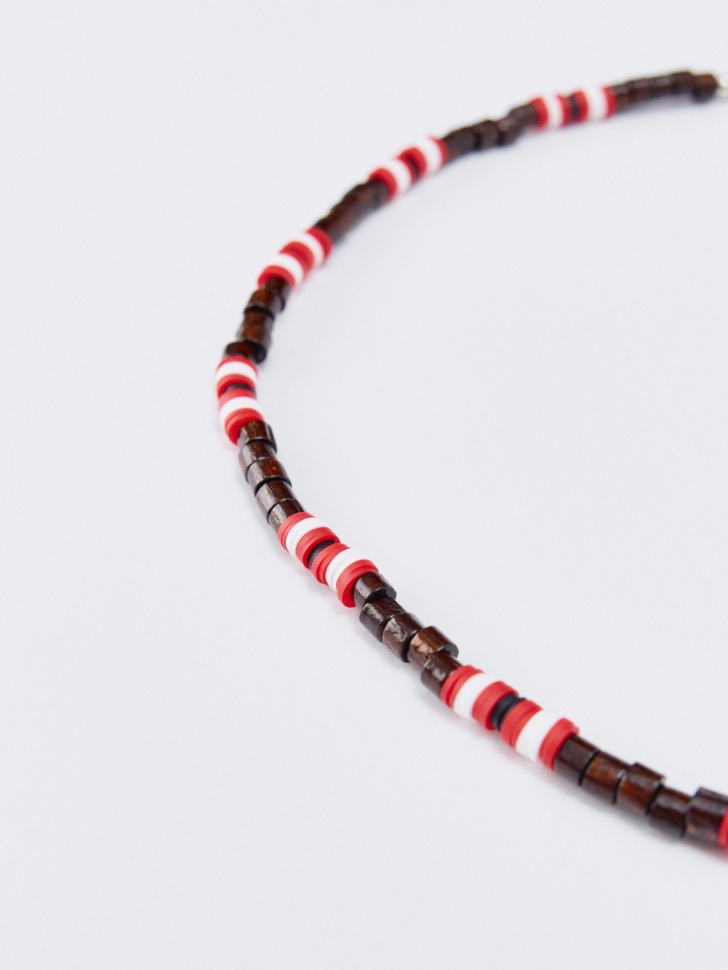 шейное украшение детское от бренда sela вид слева