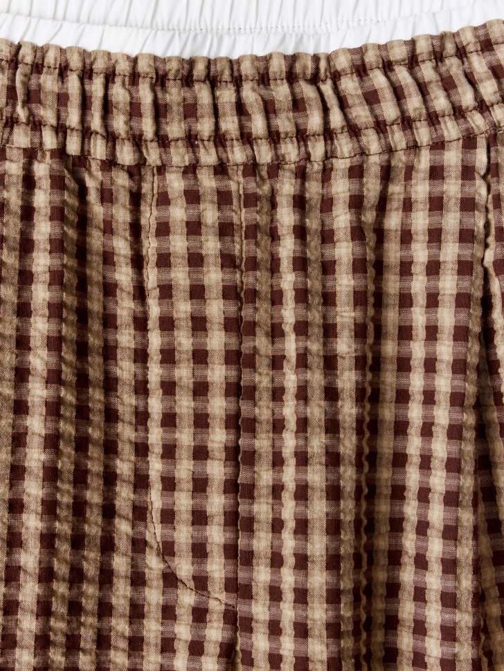 широкие брюки в клетку от бренда sela вид слева