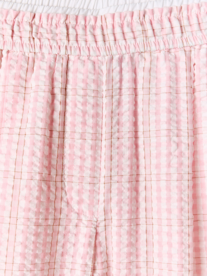 широкие брюки в клетку от бренда sela вид слева