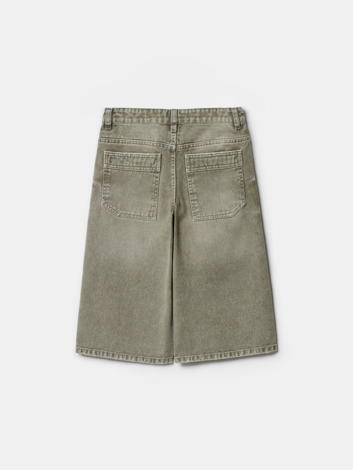 удлиненные джинсовые шорты детские от бренда sela вид слева