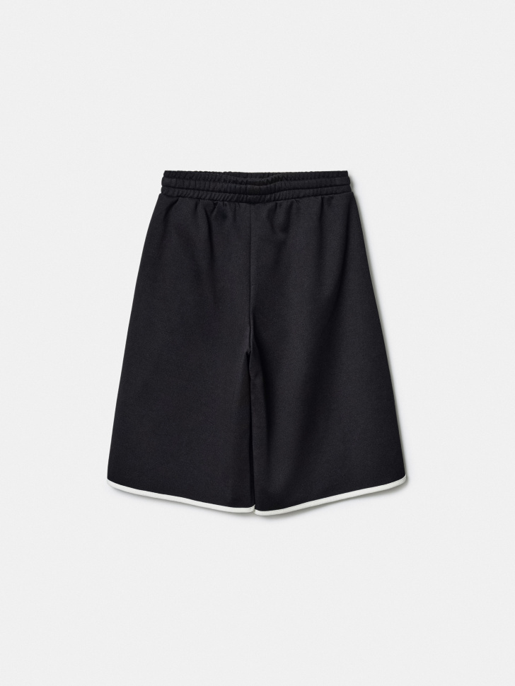 удлиненные трикотажные шорты для девочек от бренда sela вид слева