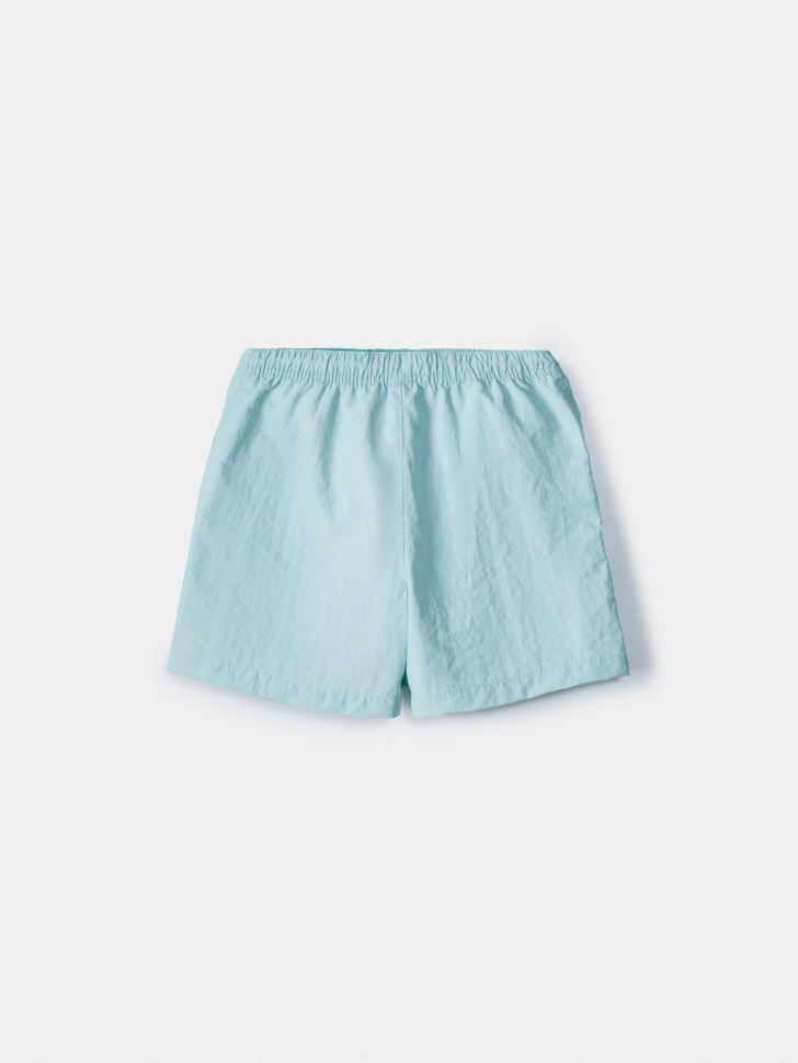 пляжные шорты с принтом для мальчиков от бренда sela вид слева