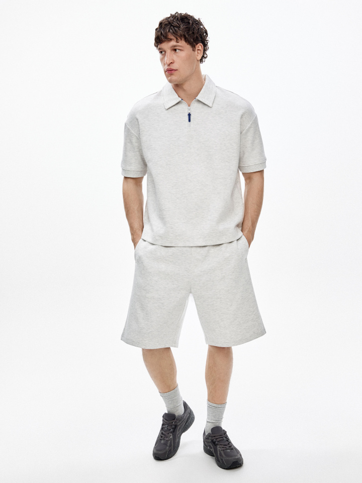 трикотажное поло оверсайз на молнии от бренда sela вид слева