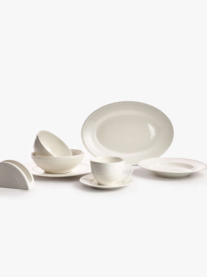 сервировочное блюдо из костяного фарфора от бренда sela вид слева