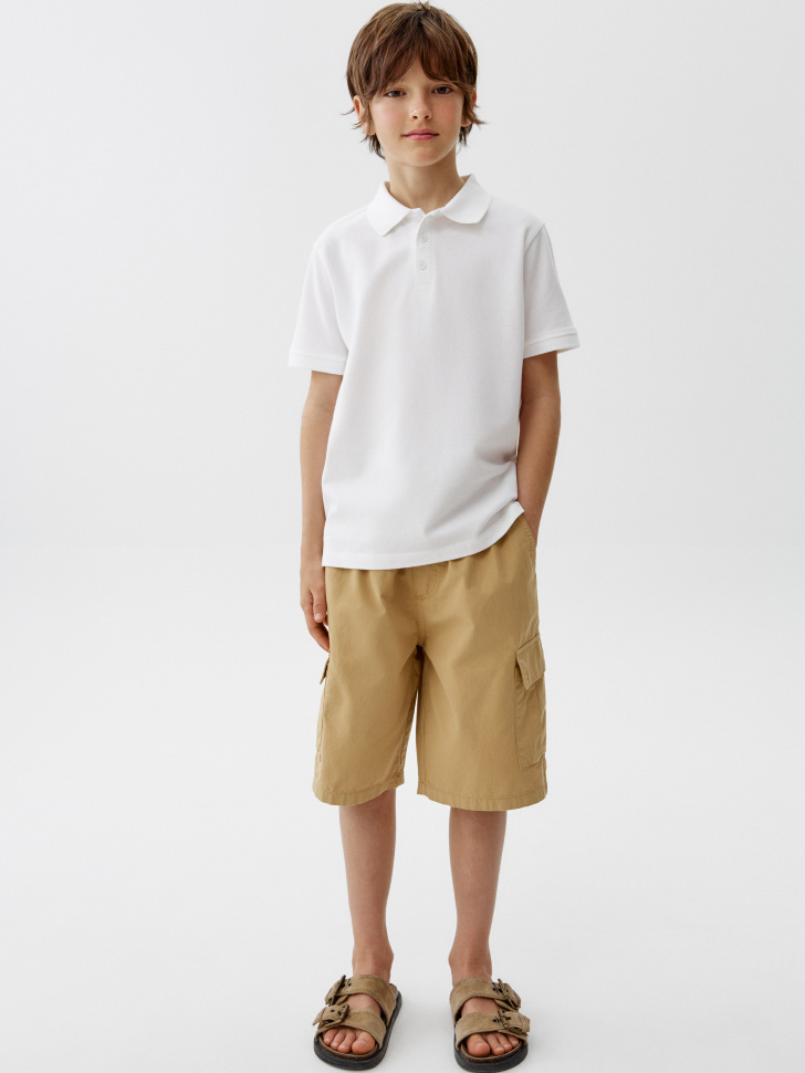 базовое поло с коротким рукавом для мальчиков от бренда sela вид слева